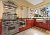 All major appliances available for all your cooking needs and extended stay.  Kitchen sink with a view over-looking swaying palm trees and Kapiolani Park.