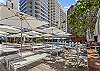 A place for guests to relax and sunbathe next to one of two swimming pools at the Ilikai. 