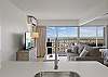 View from your kitchen sink looking towards the living room area and out over the Ala Wai boat harbor and ocean!