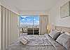 Bedroom with the dividing door closed, offers additional privacy if needed.  Beautiful views over-looking the boat harbor and ocean.