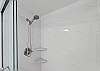 Fully-renovated bathroom with solid surfaces and tile.  Hand-held shower.