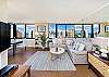Living room area with wrap-around window provide stunning views all around.