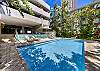 Relax and lounge by the swimming pool available for residents and their guests.