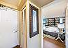 Unit front door with bedroom entrance to the right.
