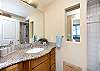 Granite top vanity with sink.