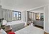 Bedroom provides views and can be separated or combined with the living room area with movable partition doors.