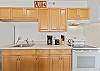 Full-sized refrigerator, stove/oven and microwave oven.