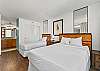 One single bed and one queen bed provide sleeping options.  Attached bathroom provides convenience