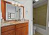 Nicely upgraded bathroom with shower/bathtub combination.