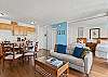 Open floor plan with fully-equipped kitchen, dining area that seats four and a pull-out sofa bed in the living room add an extra sleeping option.