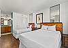 Two single beds provide sleeping options.  Attached bathroom provides convenience