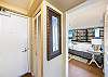 Entry way and door with the bedroom just off the main entrance.