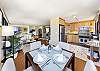 Dining area with adjacent kitchen and living room area.