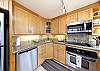 Granite counter tops and stainless steel appliances.