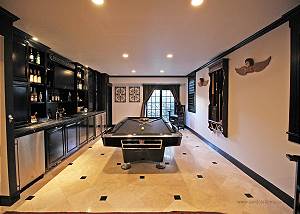 Finished lower level with pool table and bar