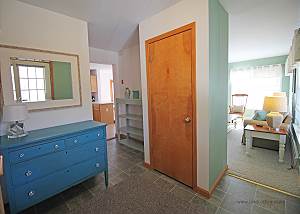 Entry way flows to living room and kitchen