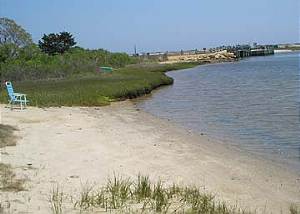 Small Beach in front of house wDike Bridge in background