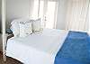 Queen Master Bedroom with Vaulted Ceilings & Balcony Access Queen Master Bedroom with Vaulted Ceilings & Balcony Access