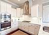 Gourmet Kitchen with Stainless Vent Hood Gourmet Kitchen with Stainless Vent Hood