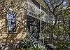 The screened porch looks out to a lush garden of native Florida The screened porch looks out to a lush garden of native Florida