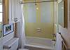 The bath adjacent to the front bedroom features a full size bath The bath adjacent to the front bedroom features a full size bath