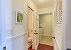 Hallway Off From Living Room, Leading To Laundry Room And Half Bath