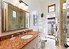 Hall bath with door to outdoor shower