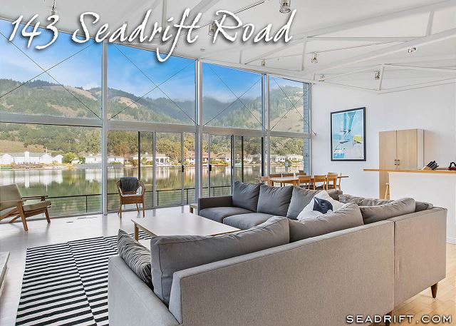 Tranquil lagoon living both inside and out with breathtaking mountain views