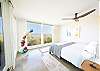 Primary bedroom looks to the ocean
