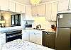 White Kitchen with new appliances and stone countertops