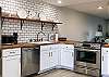 Newly renovated kitchen with butcher block counter tops and subway tile.  Brand new stainless steel appliance.