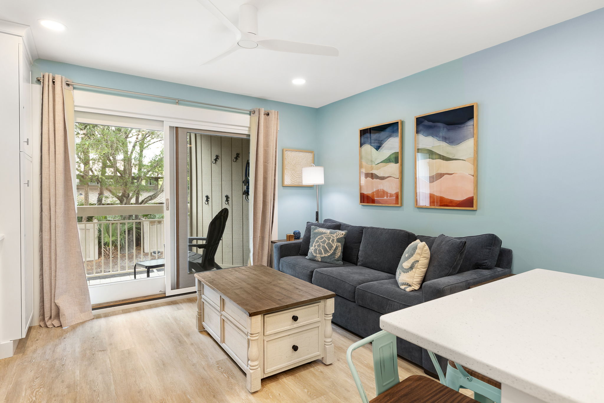 Living Room with Flat Screen TV and Private Balcony