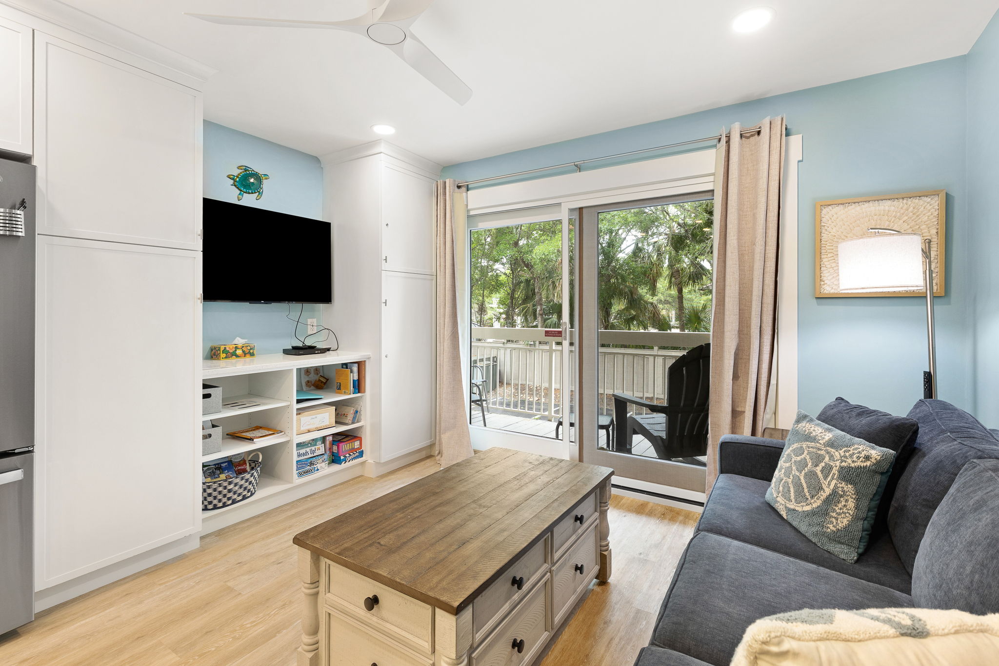 Living Room with Flat Screen TV and Private Balcony