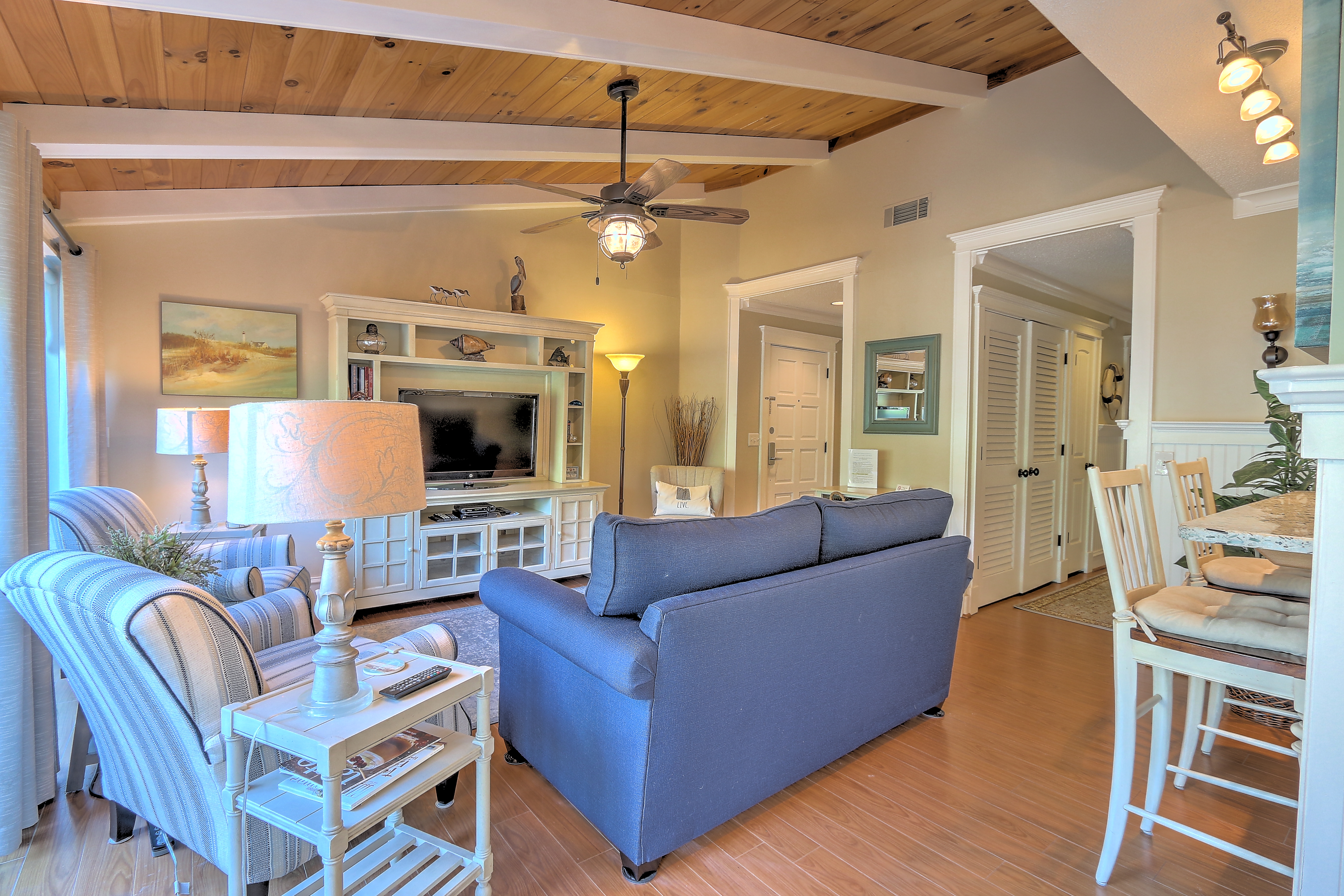Living Room with Beamed Ceilings & Flat Screen TV