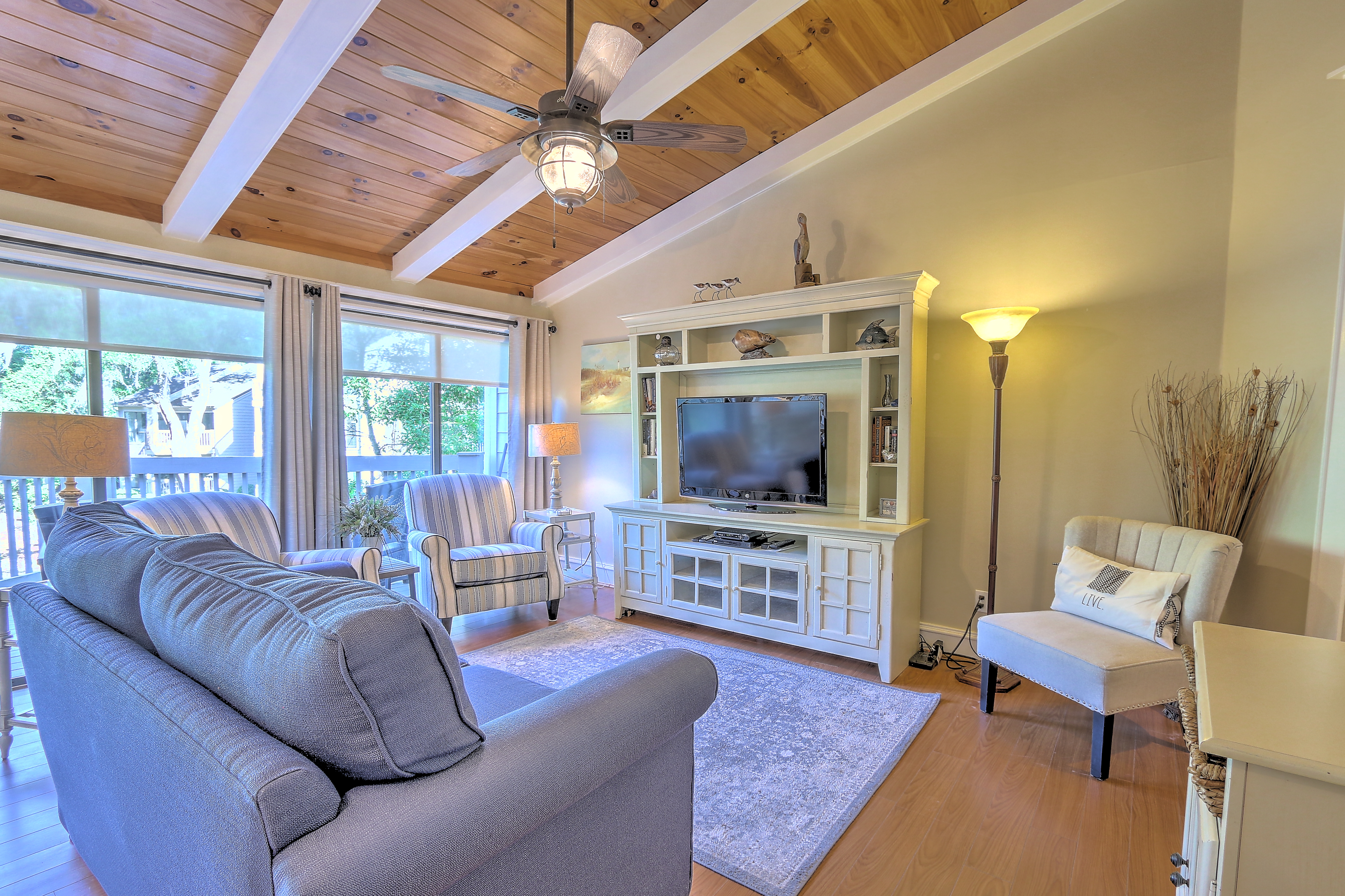 Living Room with Beamed Ceilings & Flat Screen TV