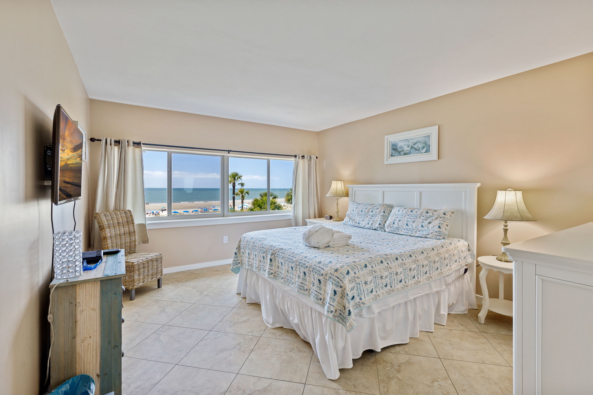 Master bedroom with King bed, flat screen TV, and private bath