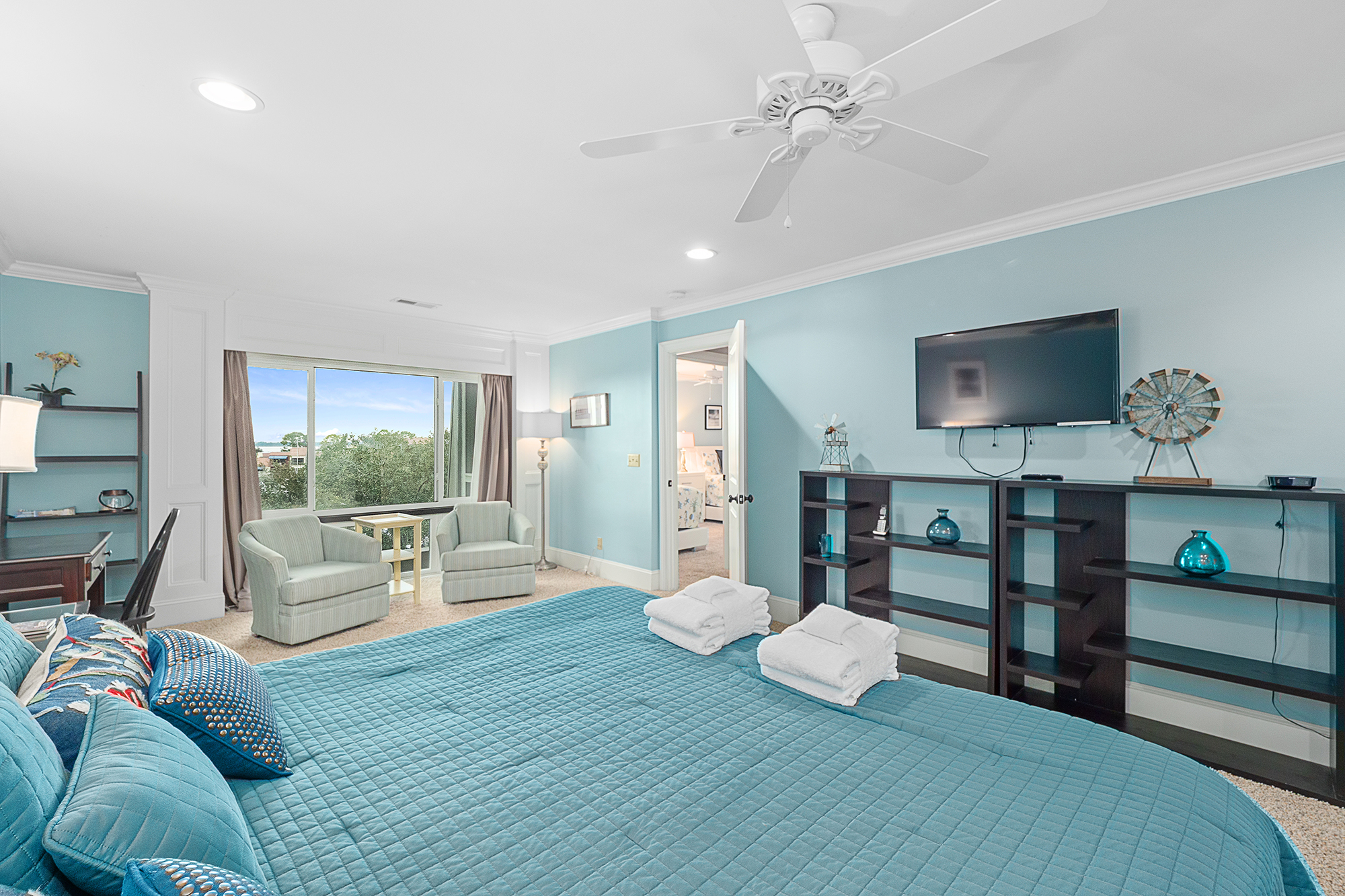 Master bedroom w/ King, flat screen Smart TV, and private bath