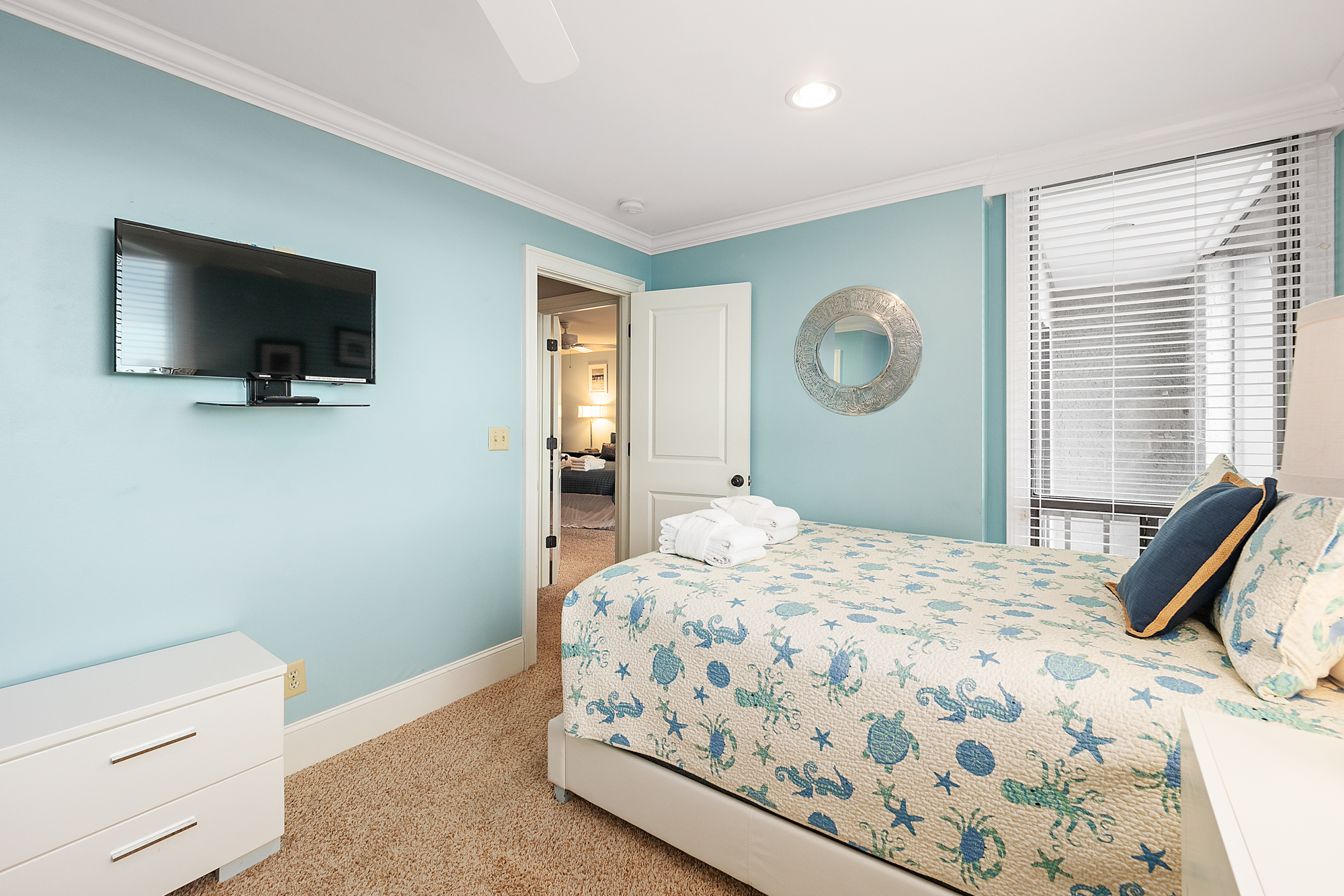 Bedroom 2 w/ two full/double beds, flat screen Smart TV, and pri