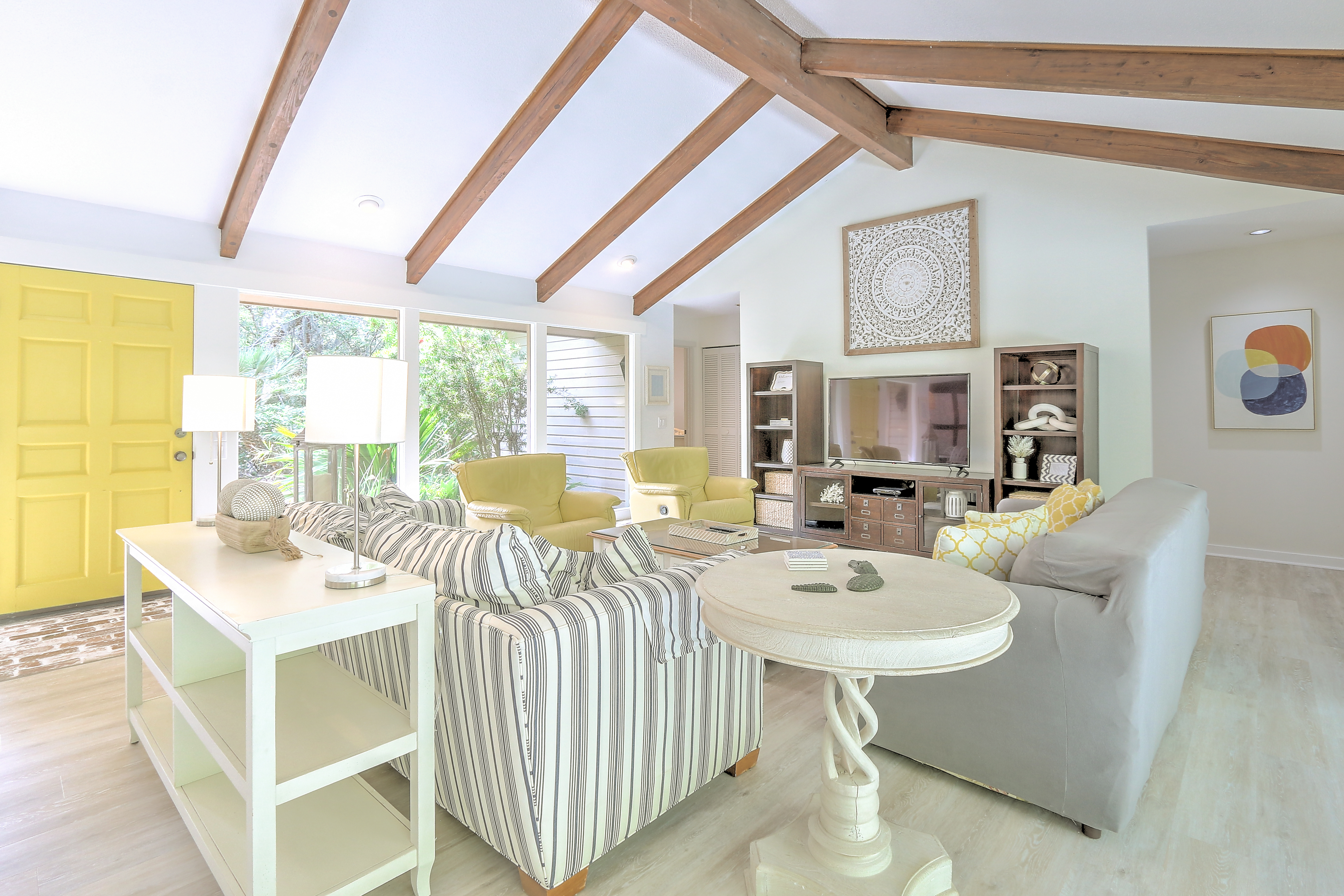 Living Room with Flat Screen TV and Pool Views