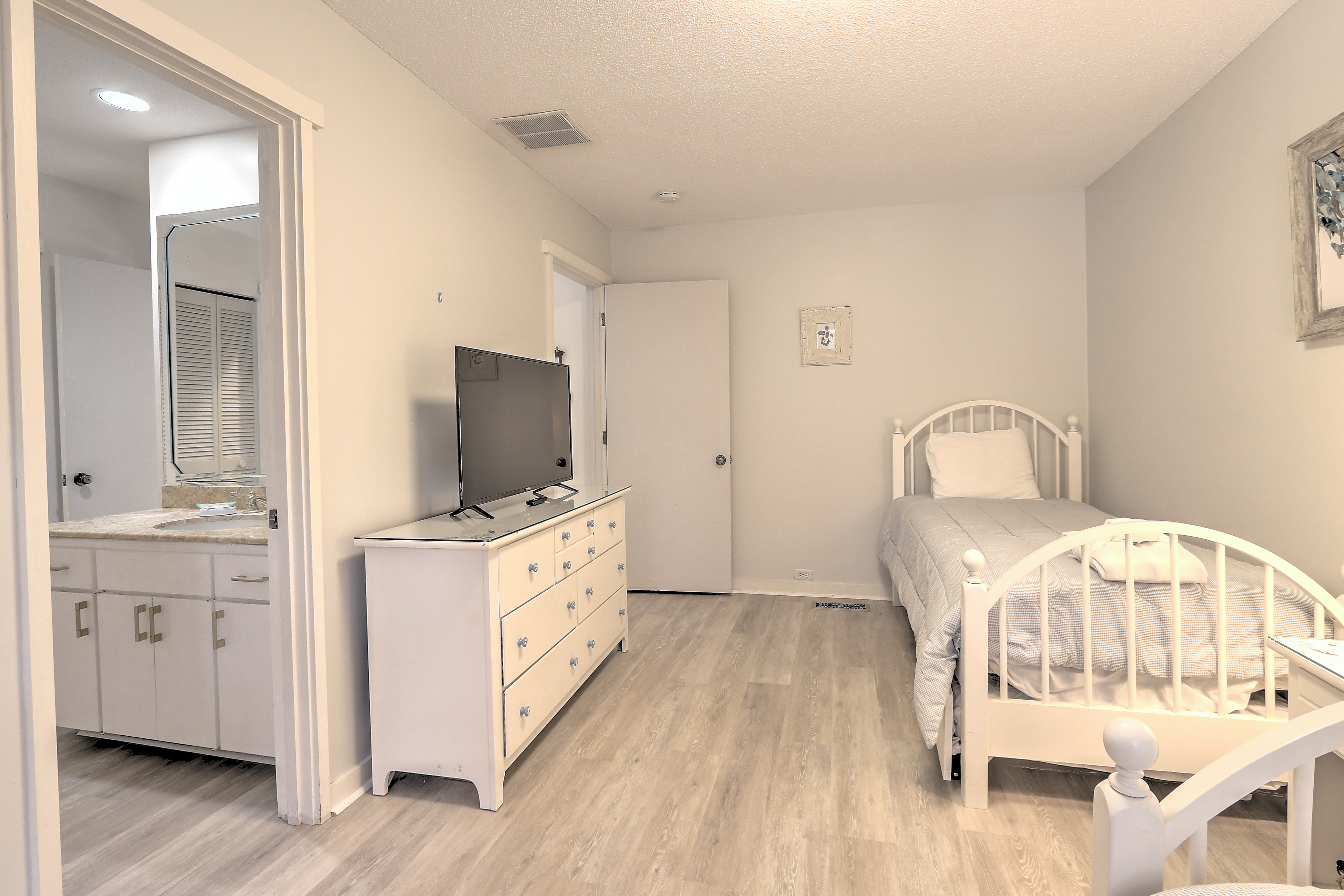 Bedroom 3 with Two Twin Trundles, Flat Screen TV, and Shared Bat