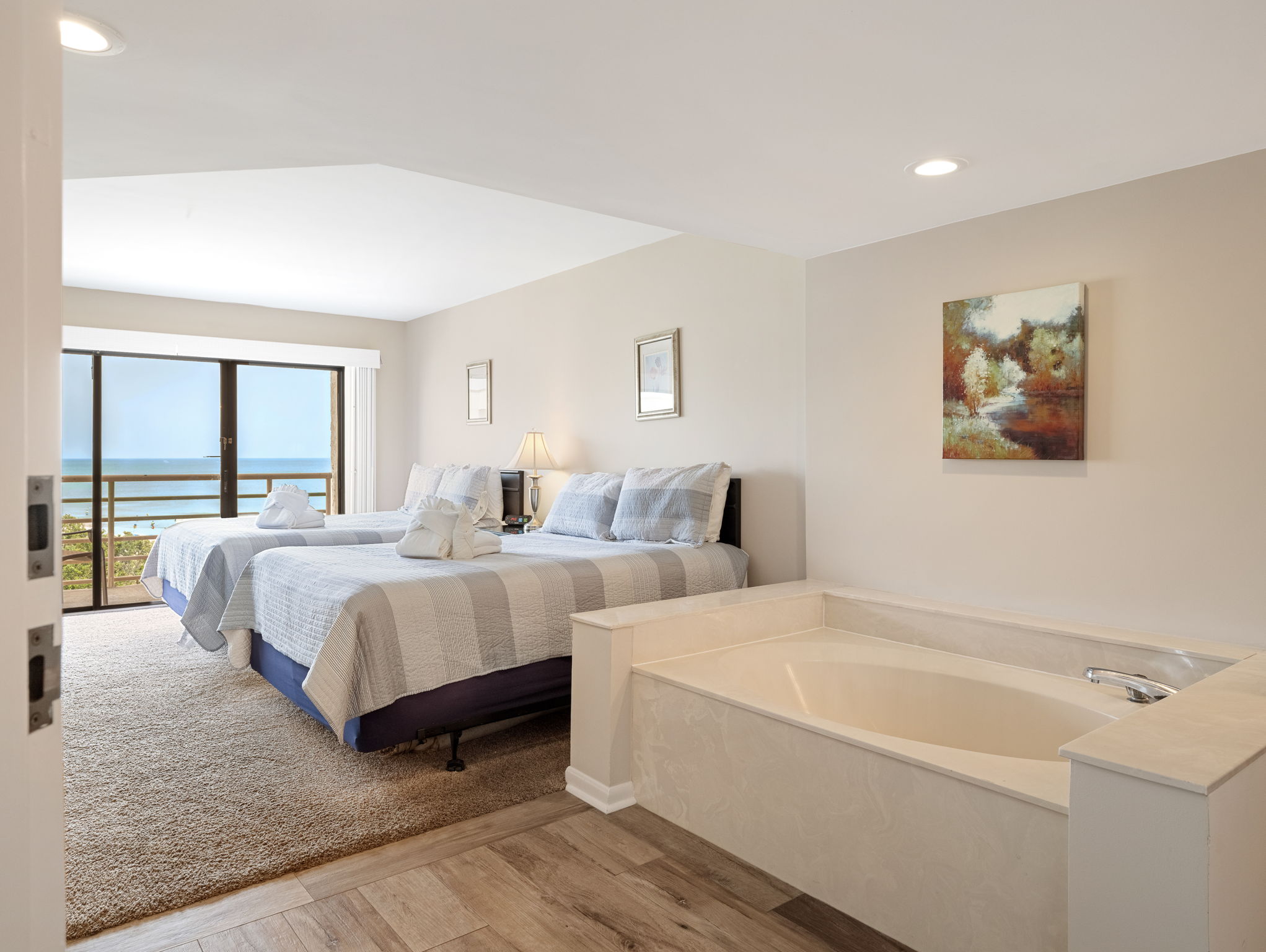 Bedroom 2 with Two Queens, Flat Screen TV, and Private Balcony