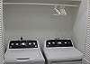 Full Size Washer/Dryer located in a hallway alcove