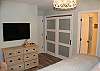 Master suite leading to a custom bathroom designed for ease of access and functionality