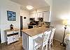 Fully equipped kitchen with breakfast bar seating