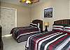 4th Bedroom - Downstairs - Dual Queen Beds with Walk-in Closet - Direct Lanai Access