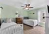 Third bedroom features a twin bed with a trundle underneath and a full bed, perfect for a small family, teens, or children