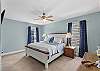 Primary suite featuring a king bed and private ensuite bathroom.