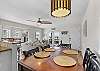 Dine with seating for six at the dining table or four at the kitchen island.
