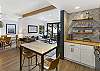 An island with seating and stainless-steel appliances makes this kitchen a cook's dream. 