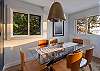 Enjoy your water view meal at this glass table with dining for 6